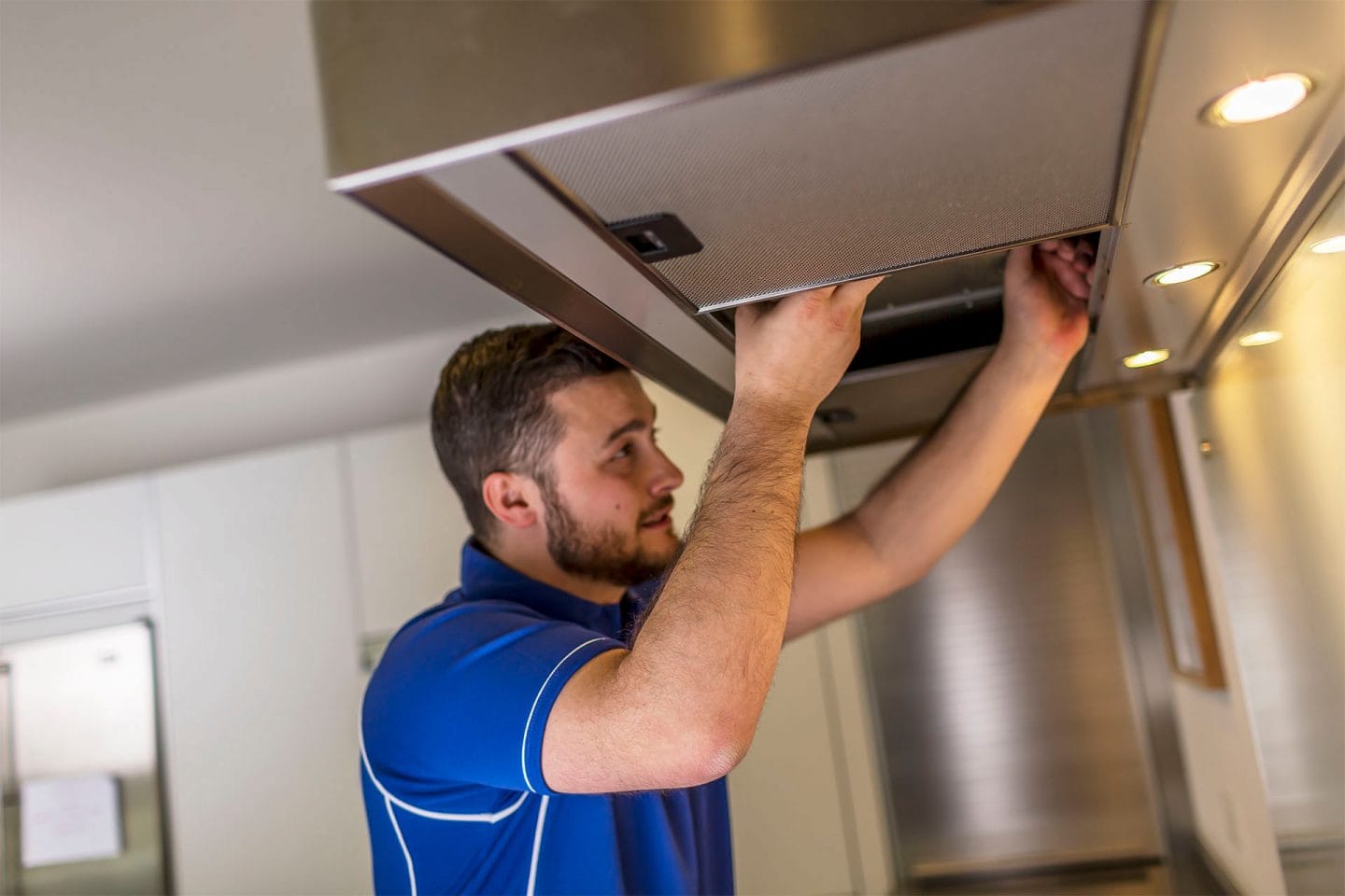 Kitchen hood installer fitting commercial canopy in Kettering