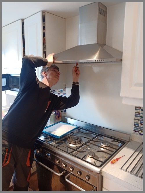 Kitchen hood installer in Kettering preparing commercial extraction canopy